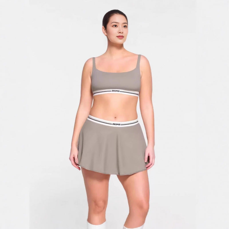 Sports skirt set with bra straps and midriff-baring design