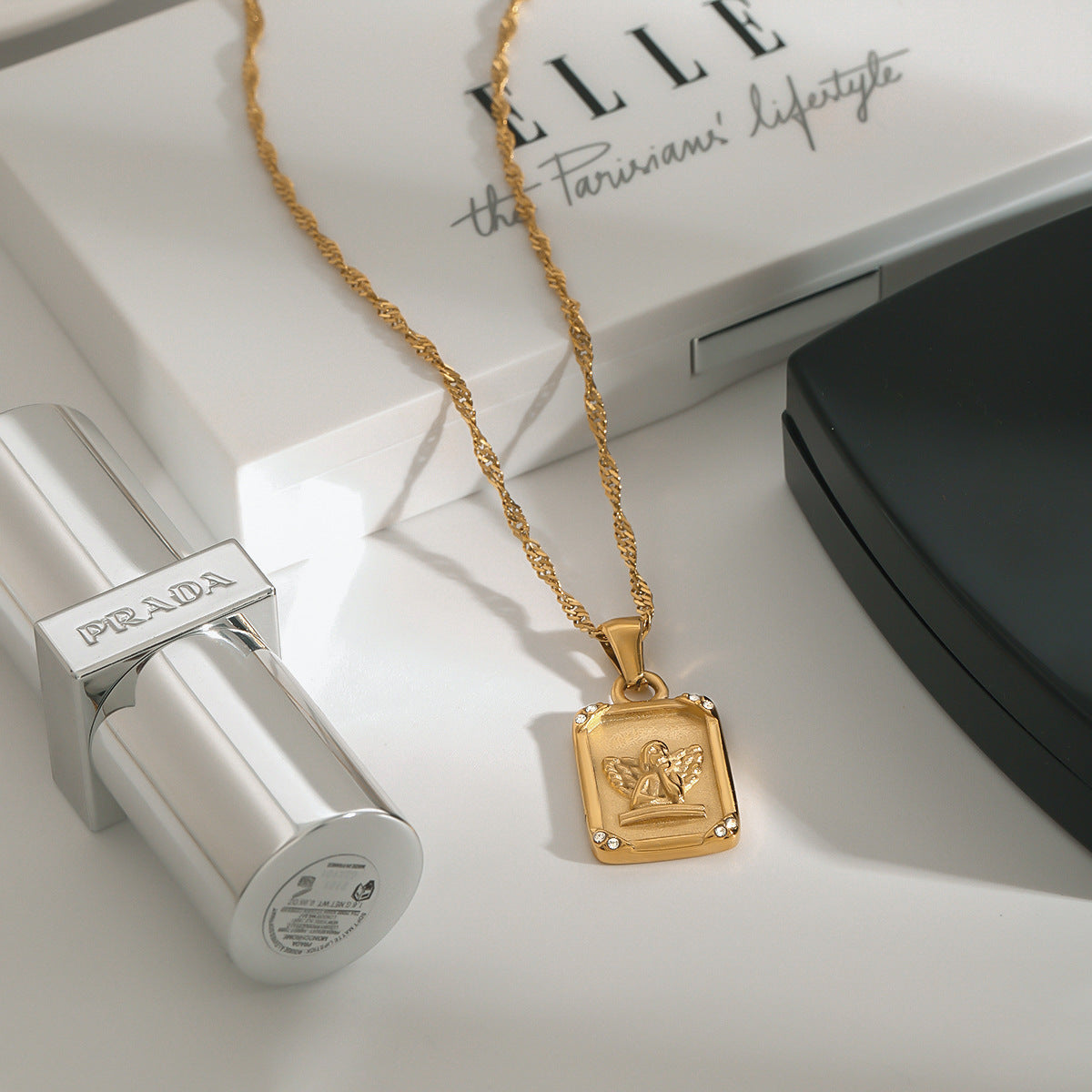 Square-shaped relief angel pendant