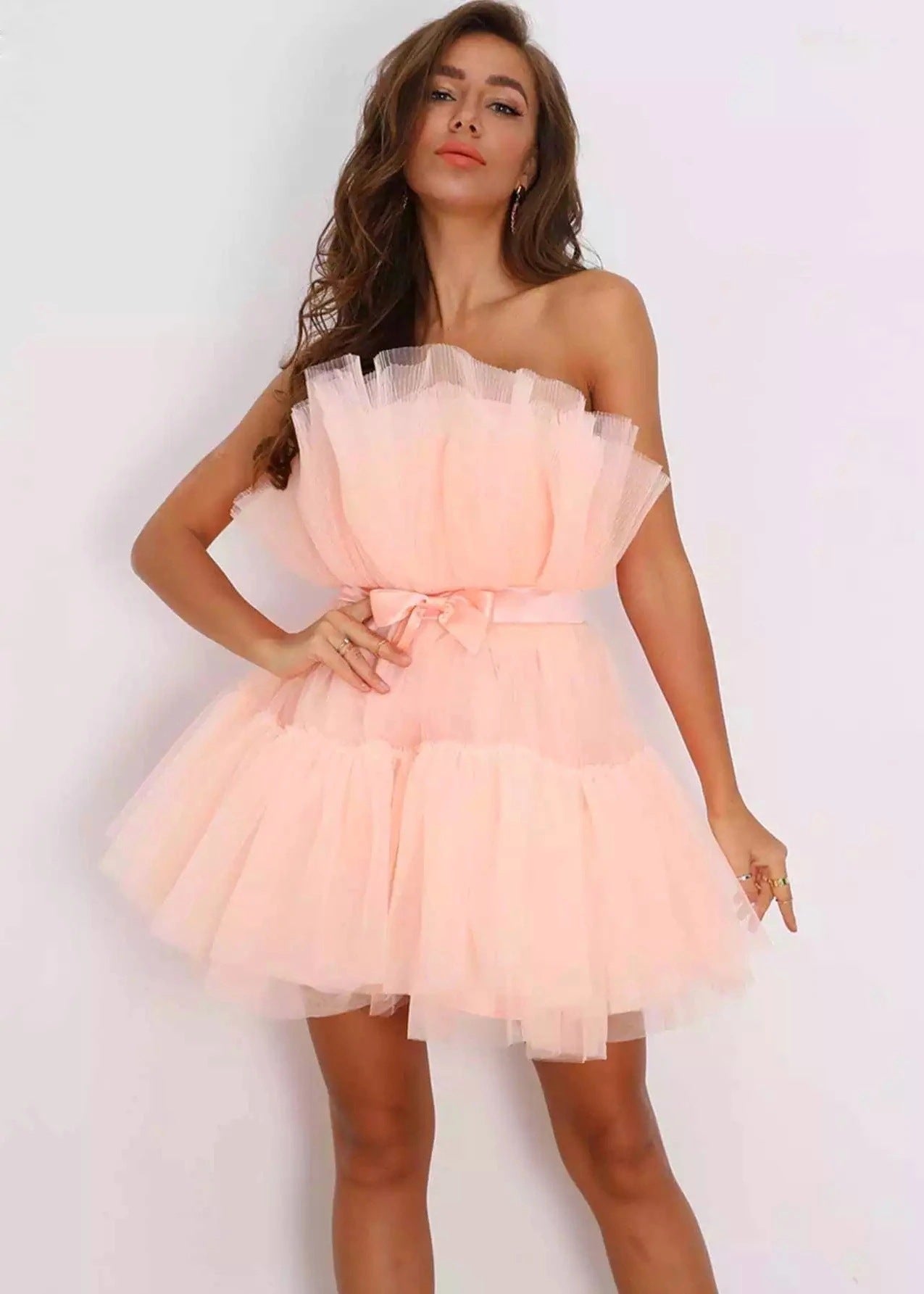 Strapless netted ballgown with bow details and puff sleeves