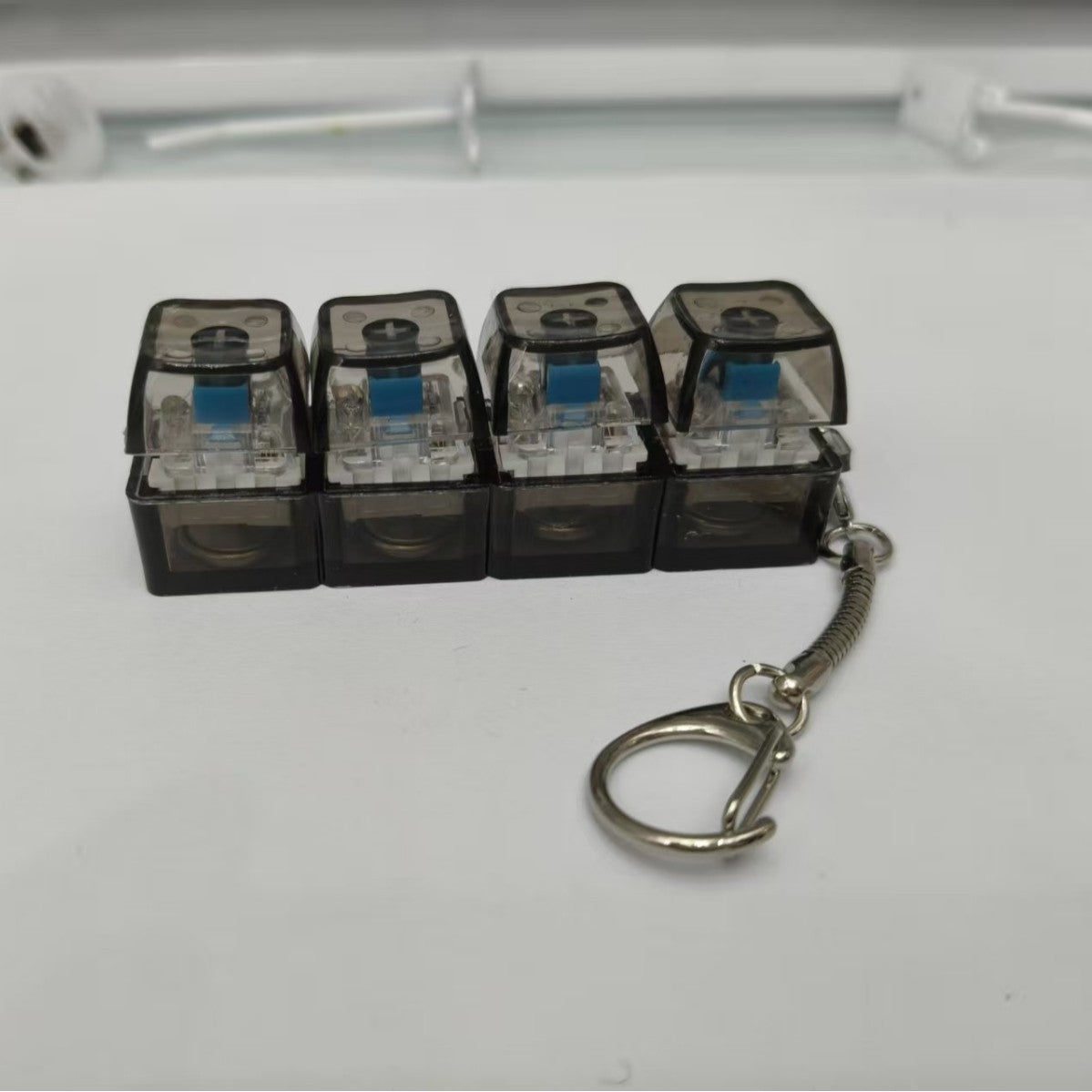 Test shaft pressure relief keychain
