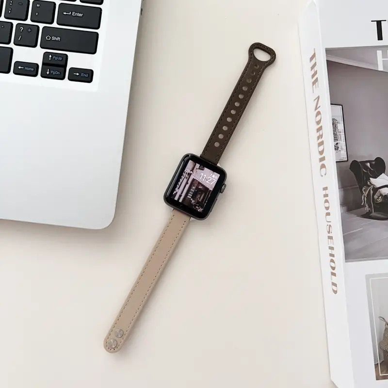 The Apple Watch features a slim double-pin strap