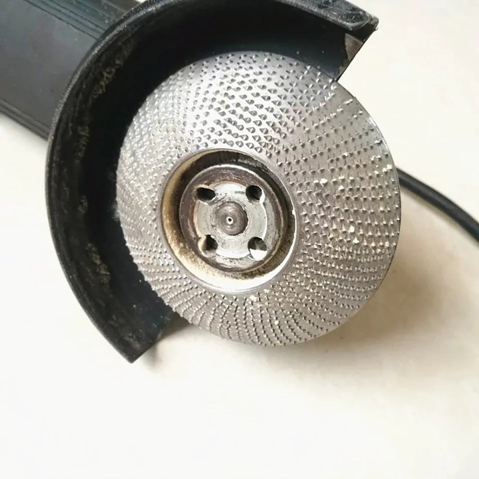 The carpenter grinds and shapes the piercing plate