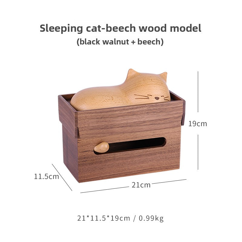 The cat's sleeping paper towel box