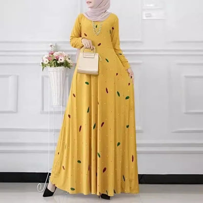The dress is printed with leaf dots