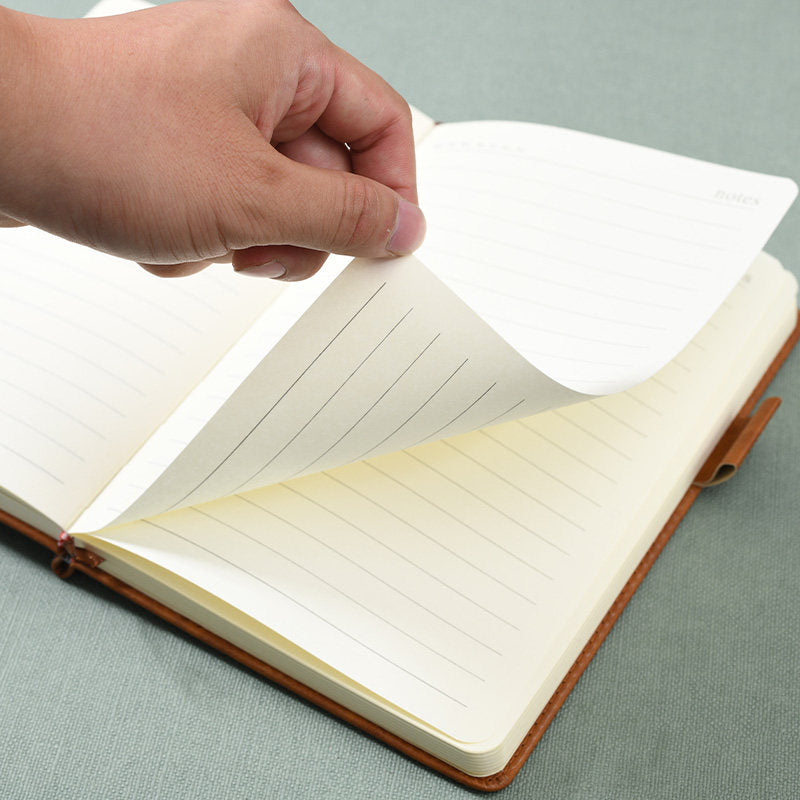 Thick leather-bound notepad