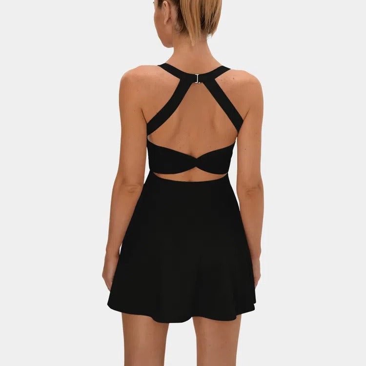 This backless sports dress features a short skirt with built-in shorts and is highly elastic