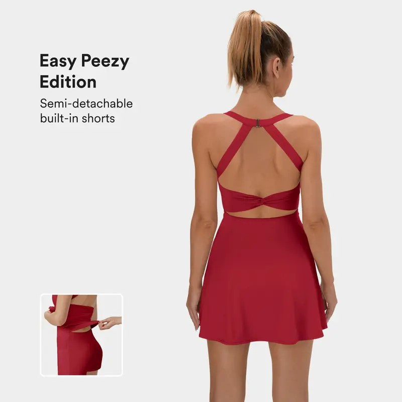 This backless sports dress features a short skirt with built-in shorts and is highly elastic
