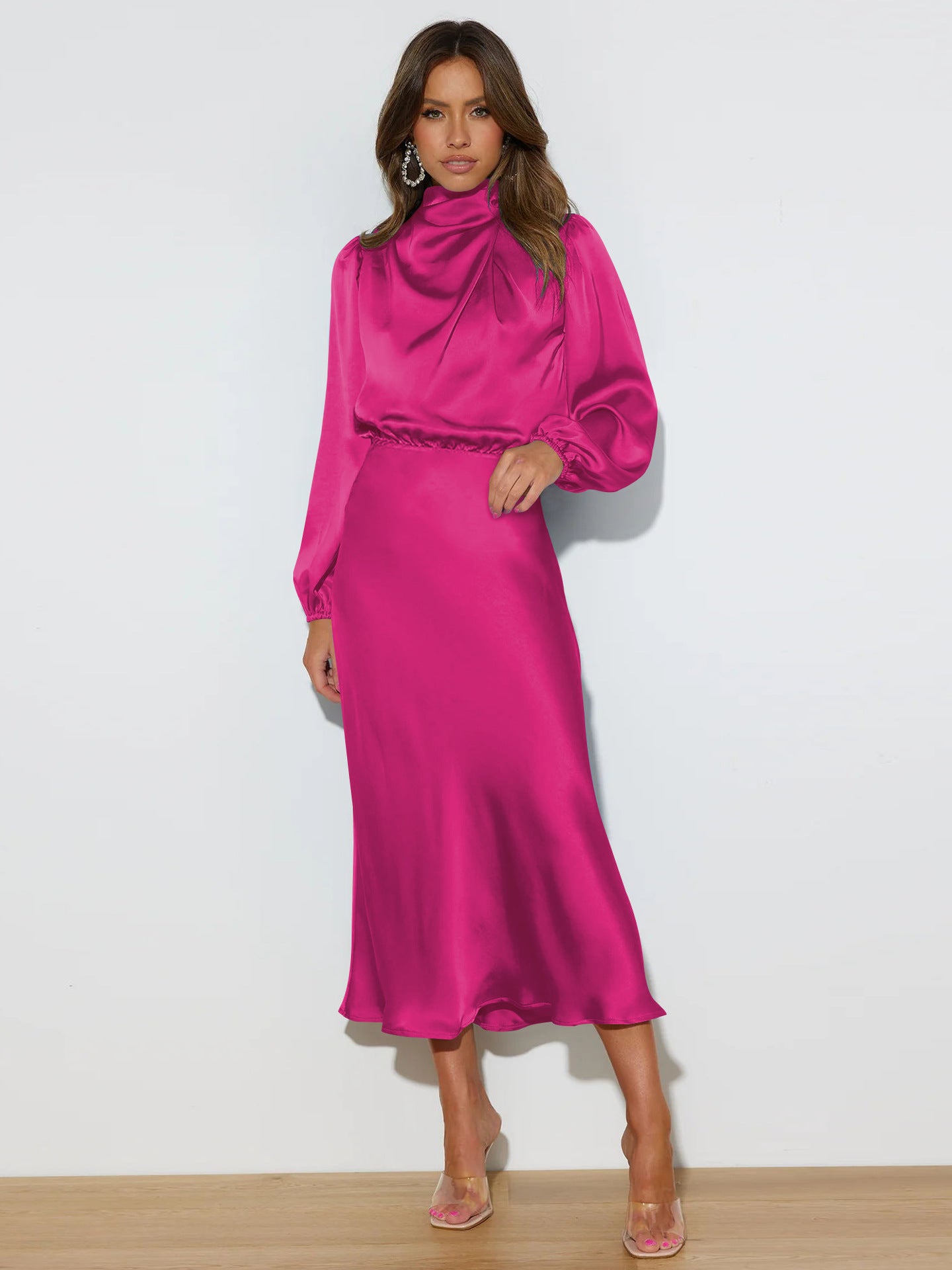 This high-end satin long-sleeved loose dress is an elegant and refined evening dress for women