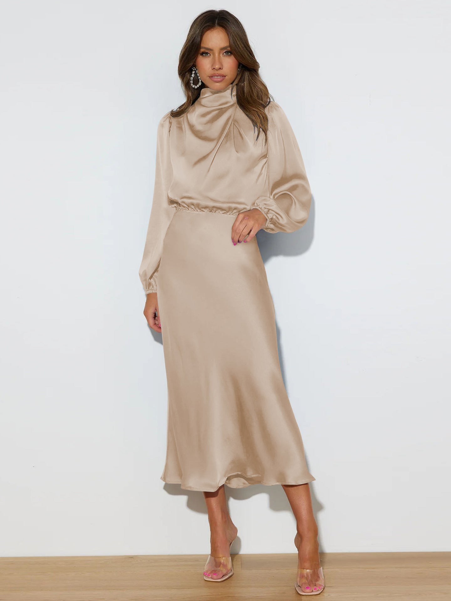 This high-end satin long-sleeved loose dress is an elegant and refined evening dress for women