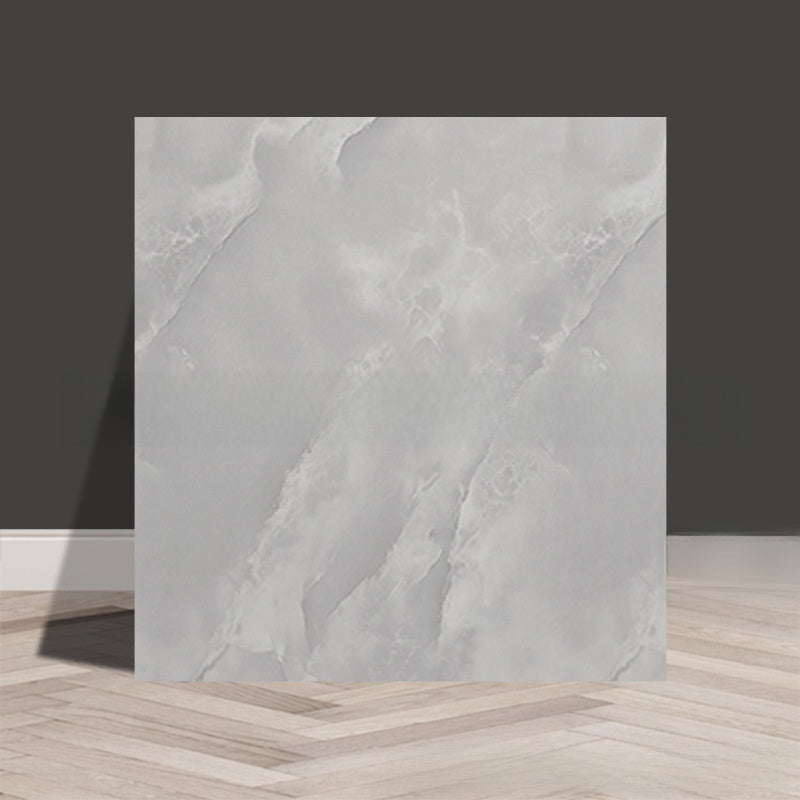 Tile stickers are pasted on the imitation marble wall