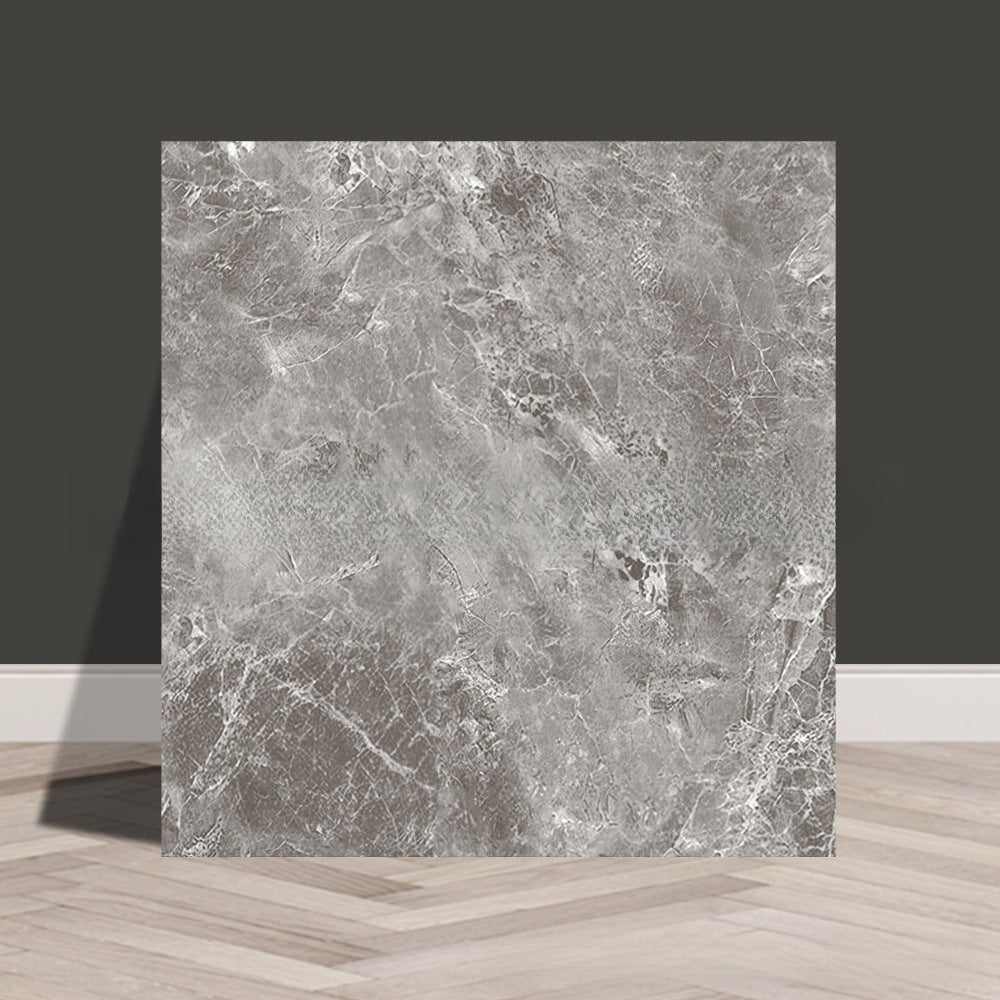 Tile stickers are pasted on the imitation marble wall