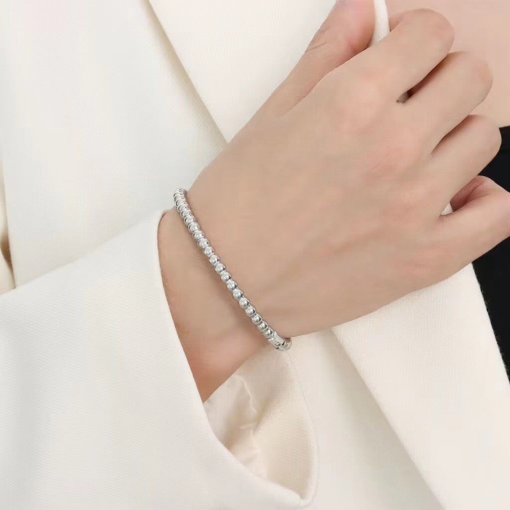 Titanium and steel bracelet set with diamonds