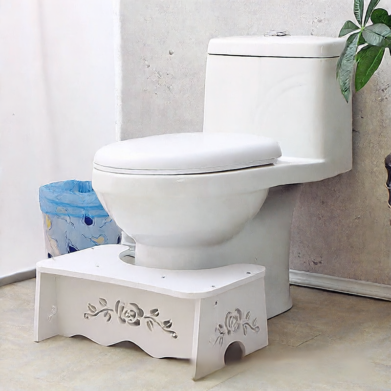 Toilet seat footrest