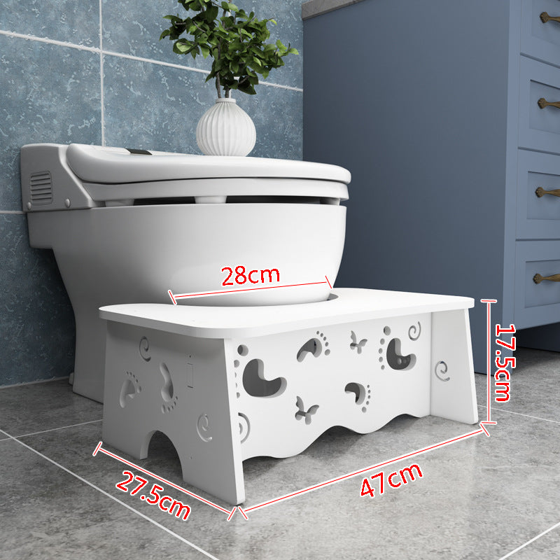 Toilet seat footrest