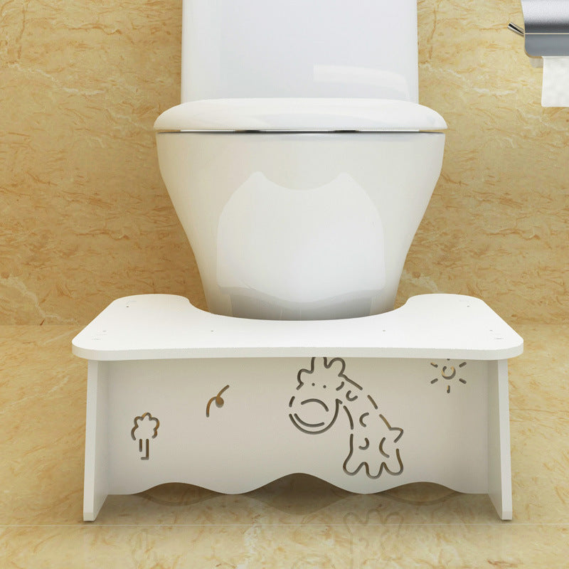 Toilet seat footrest