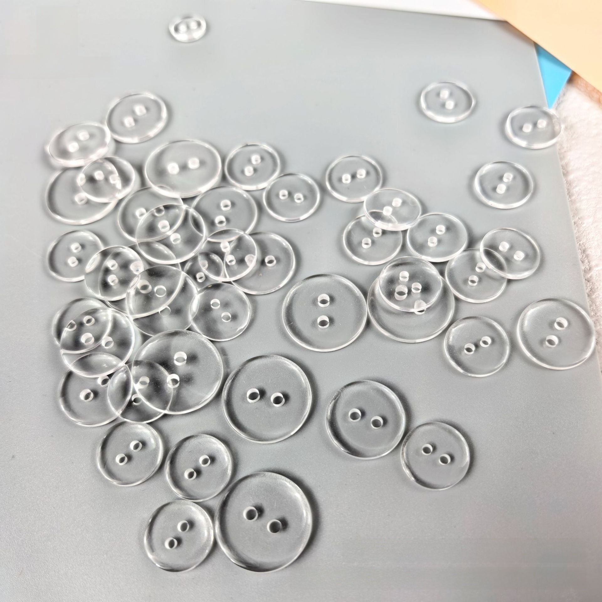 Transparent resin button