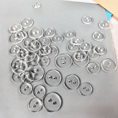 Transparent resin button