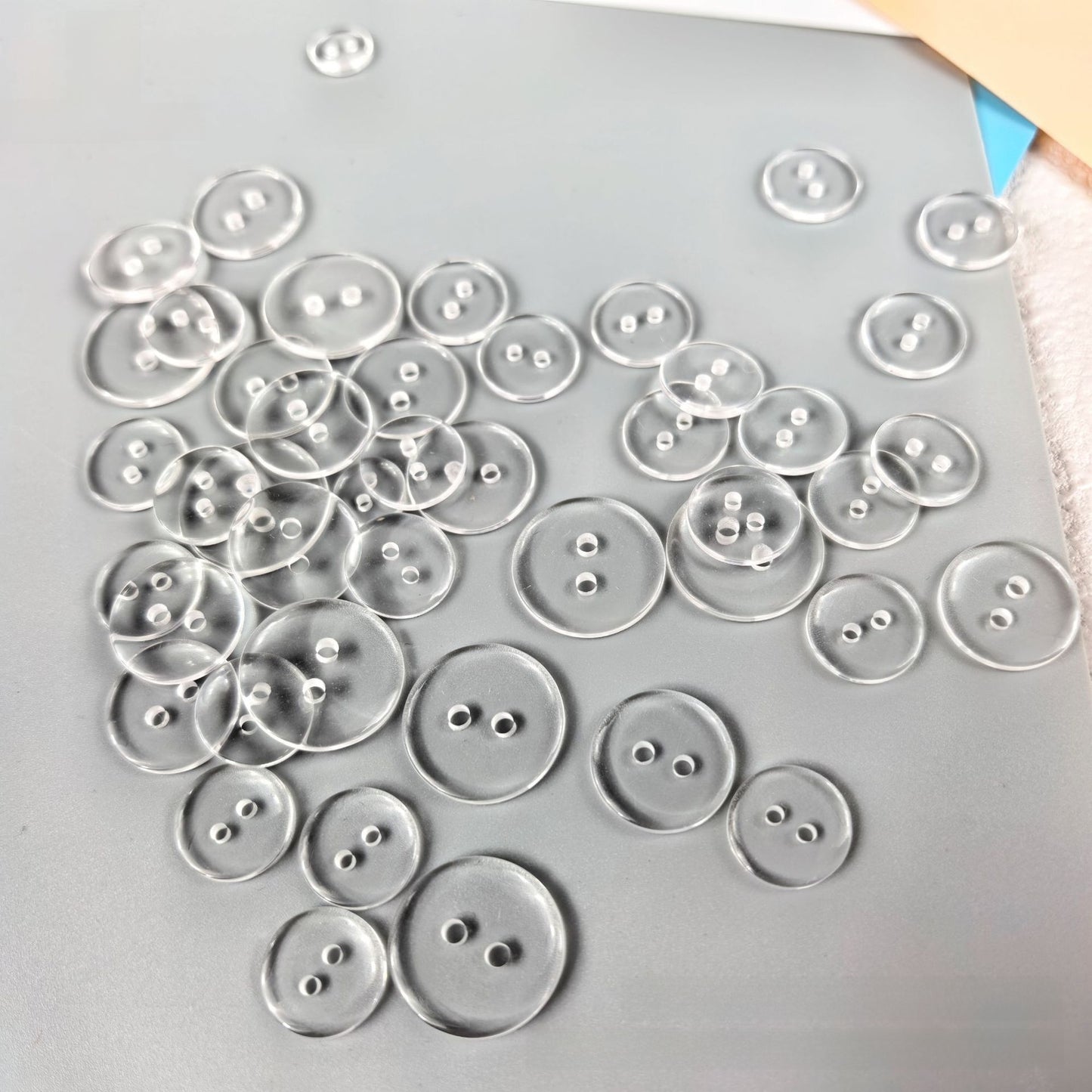 Transparent resin button