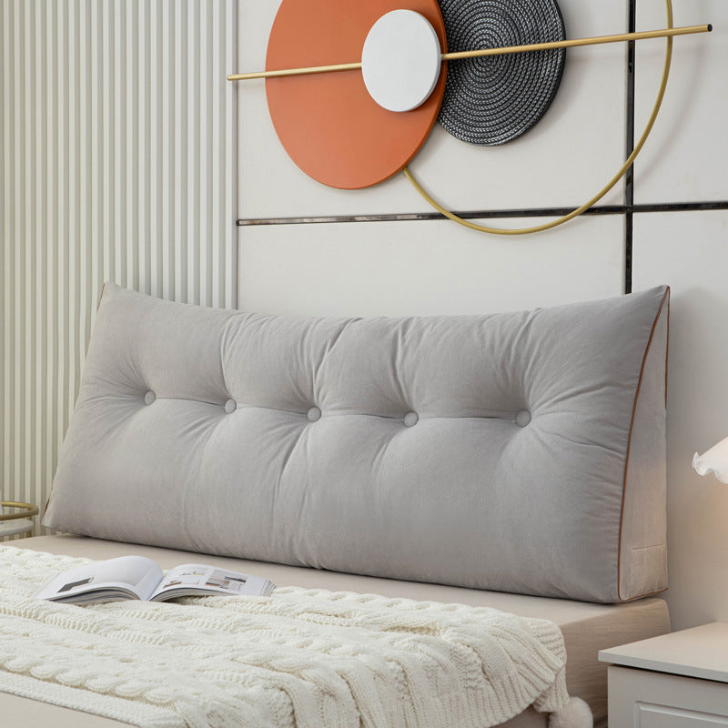 Triangular bedside cushion