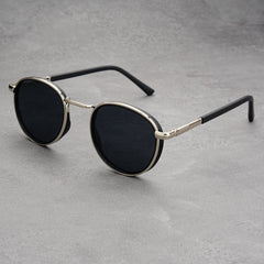 Black frame grey lens