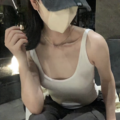 Vest with built-in breast pad
