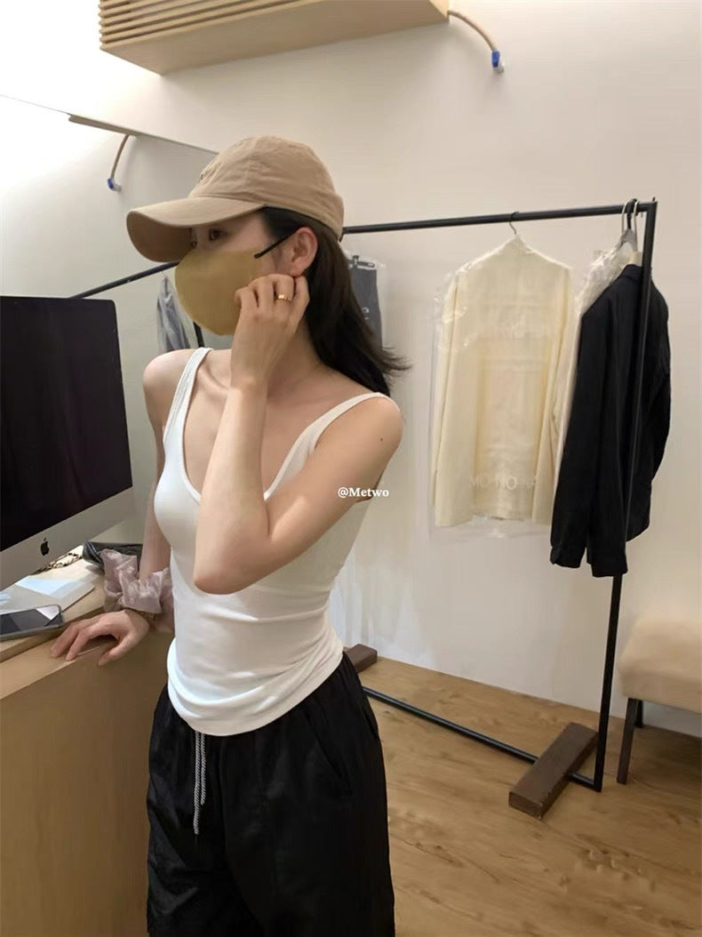 Vest with built-in breast pad