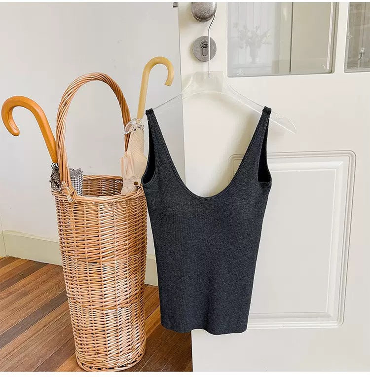 Vest with built-in breast pad