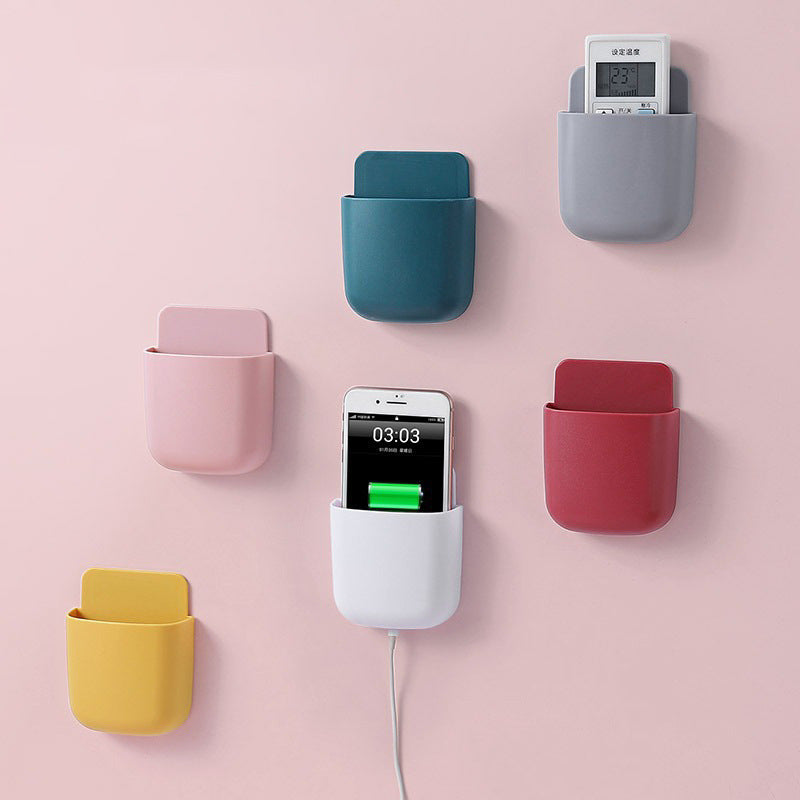 Wall-mounted bedside mobile phone charging storage rack
