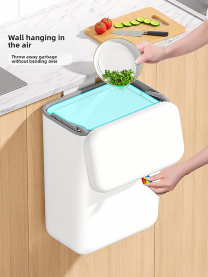 Wall-mounted trash can in the kitchen