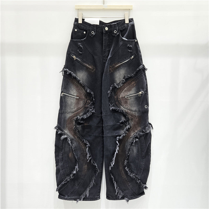 Washed curved-patterned mud-dyed jeans