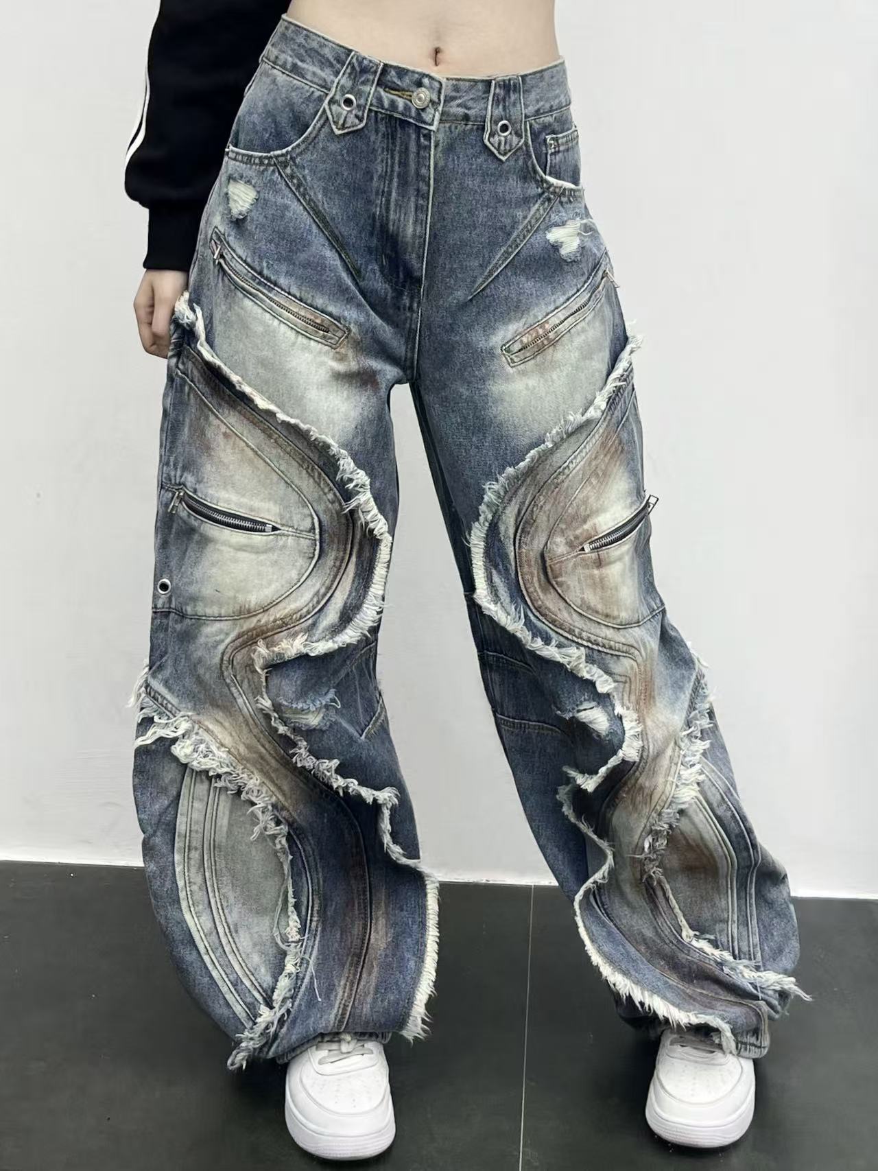Washed curved-patterned mud-dyed jeans