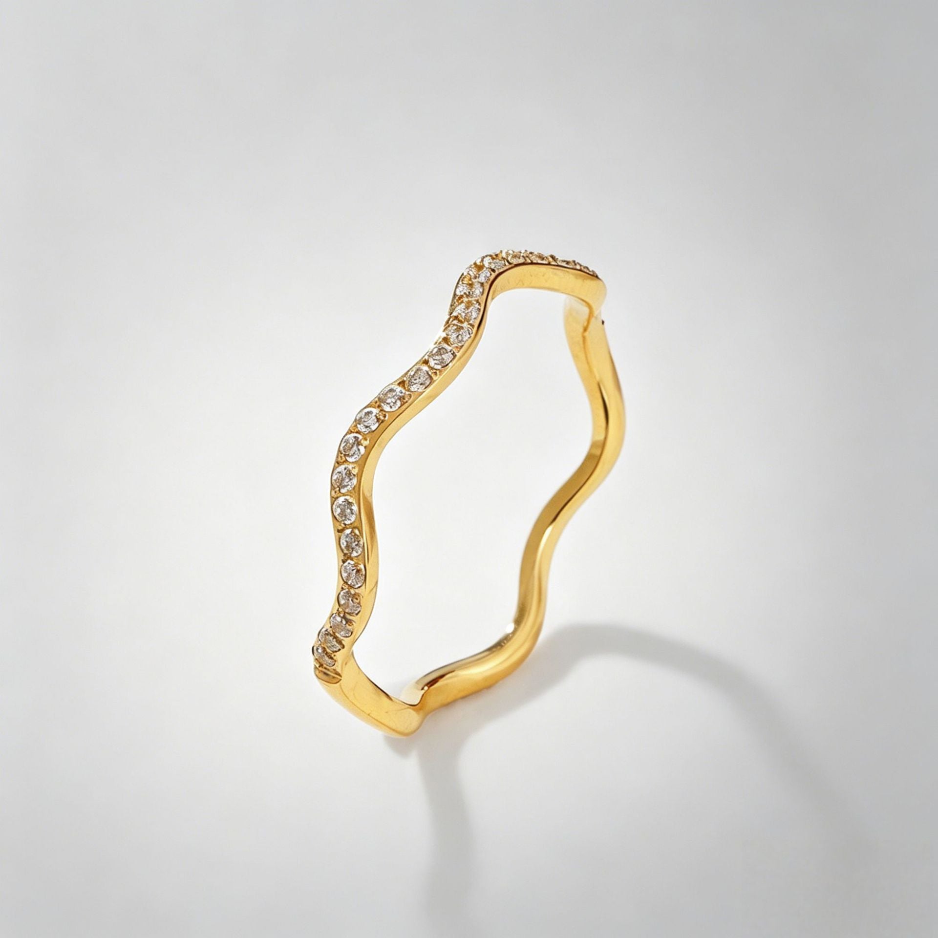 Wavy diamond-studded ring