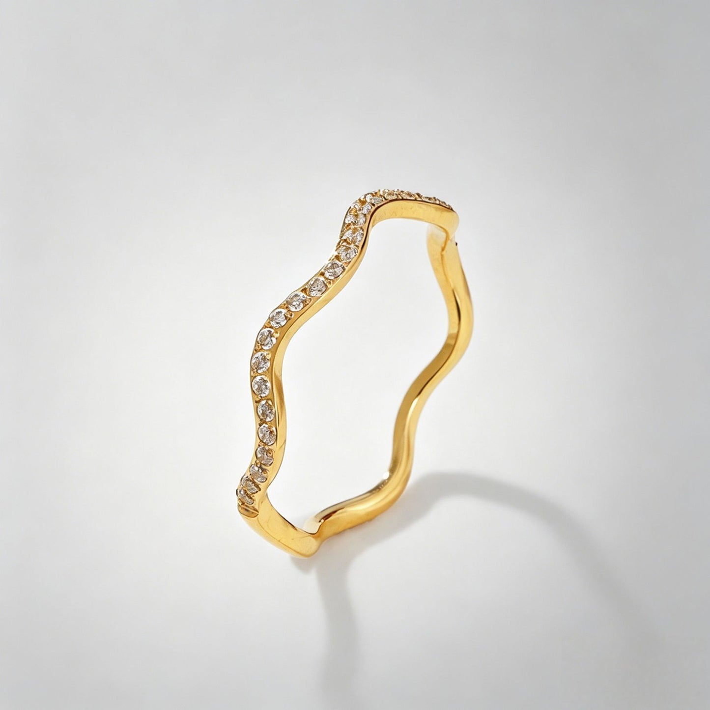Wavy diamond-studded ring