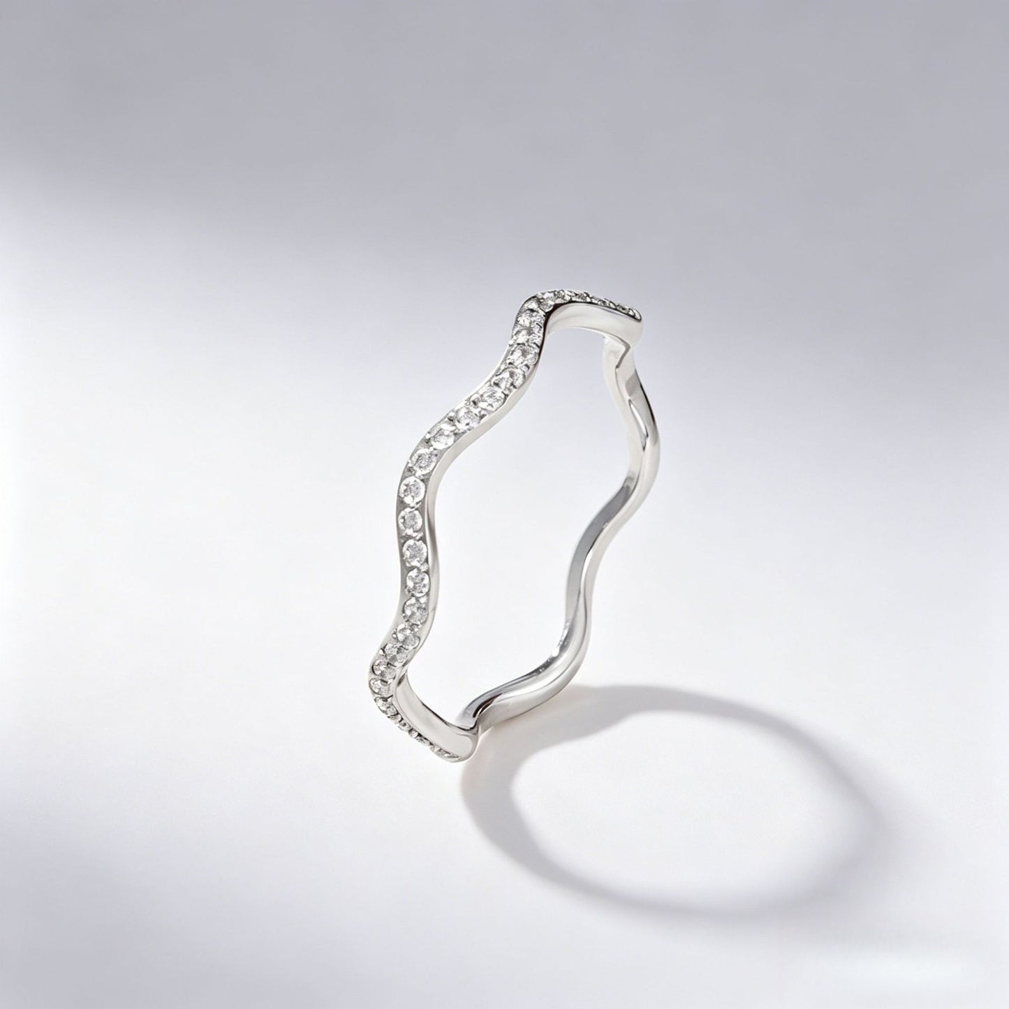 Wavy diamond-studded ring