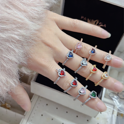 White copper ring with a red heart design