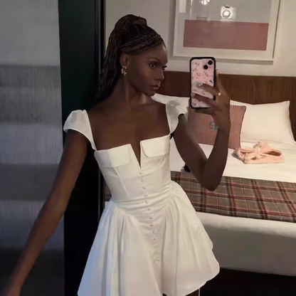 White pleated waist-cinching dress