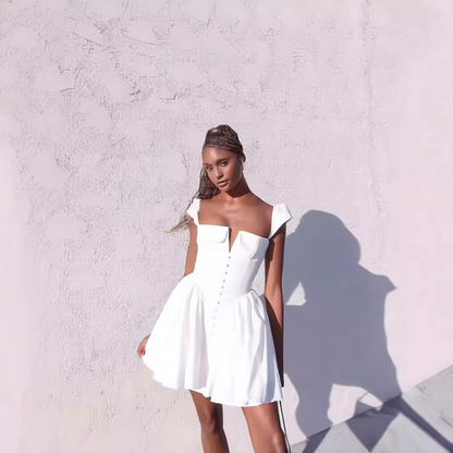 White pleated waist-cinching dress