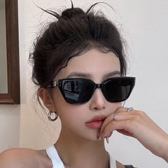Black frame grey lens