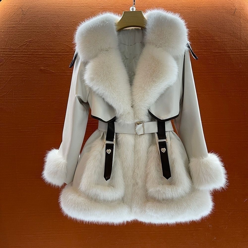Women's mid-length fur coat with large fur collar and tie