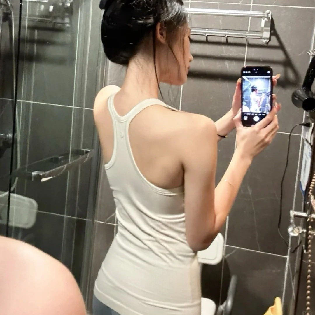 Women's sports vest with built-in chest pad