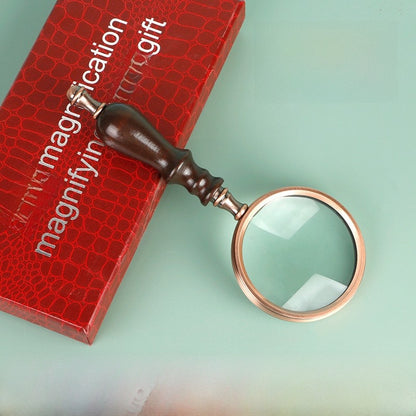 Wooden-handled hand magnifier