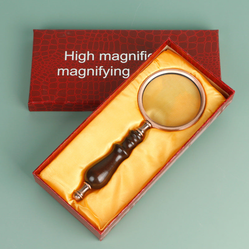 Wooden-handled hand magnifier